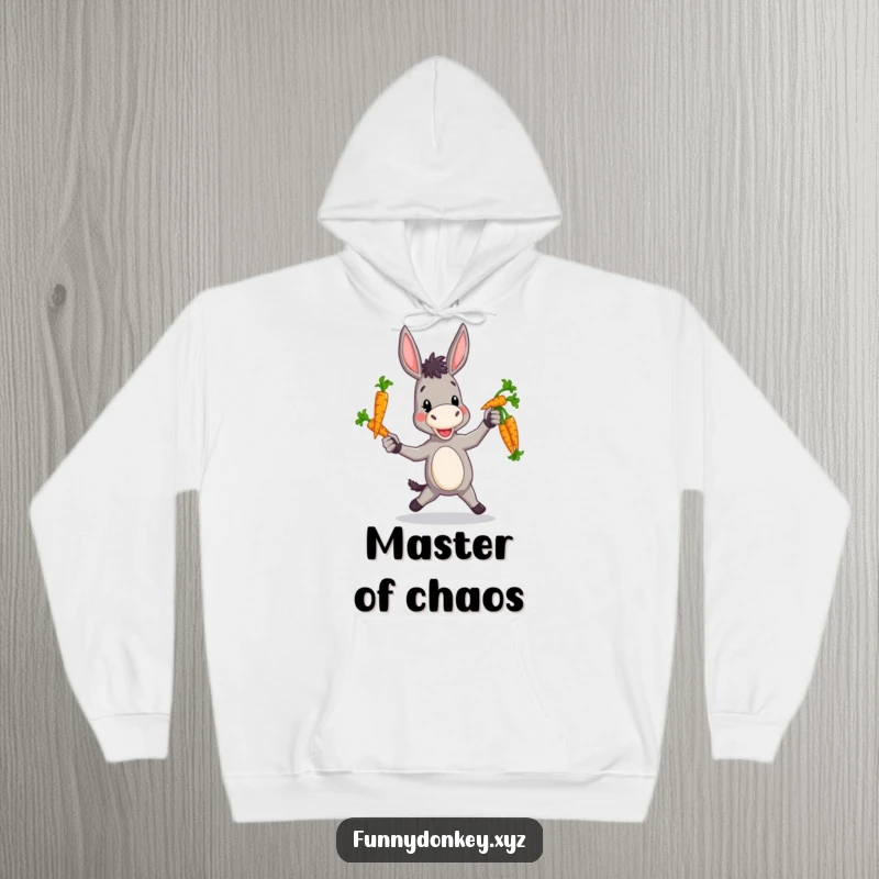 Funny hoodie featuring a donkey engaged in a charmingly clumsy act of juggling colorful carrots.